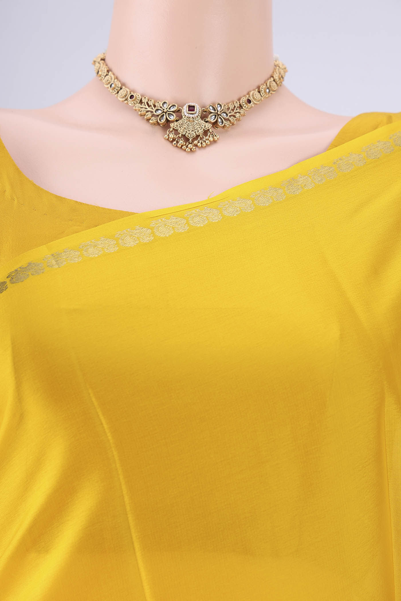 Border image of Lemon Yellow Mysore Crepe Saree with Plain Body and Zari Border. 