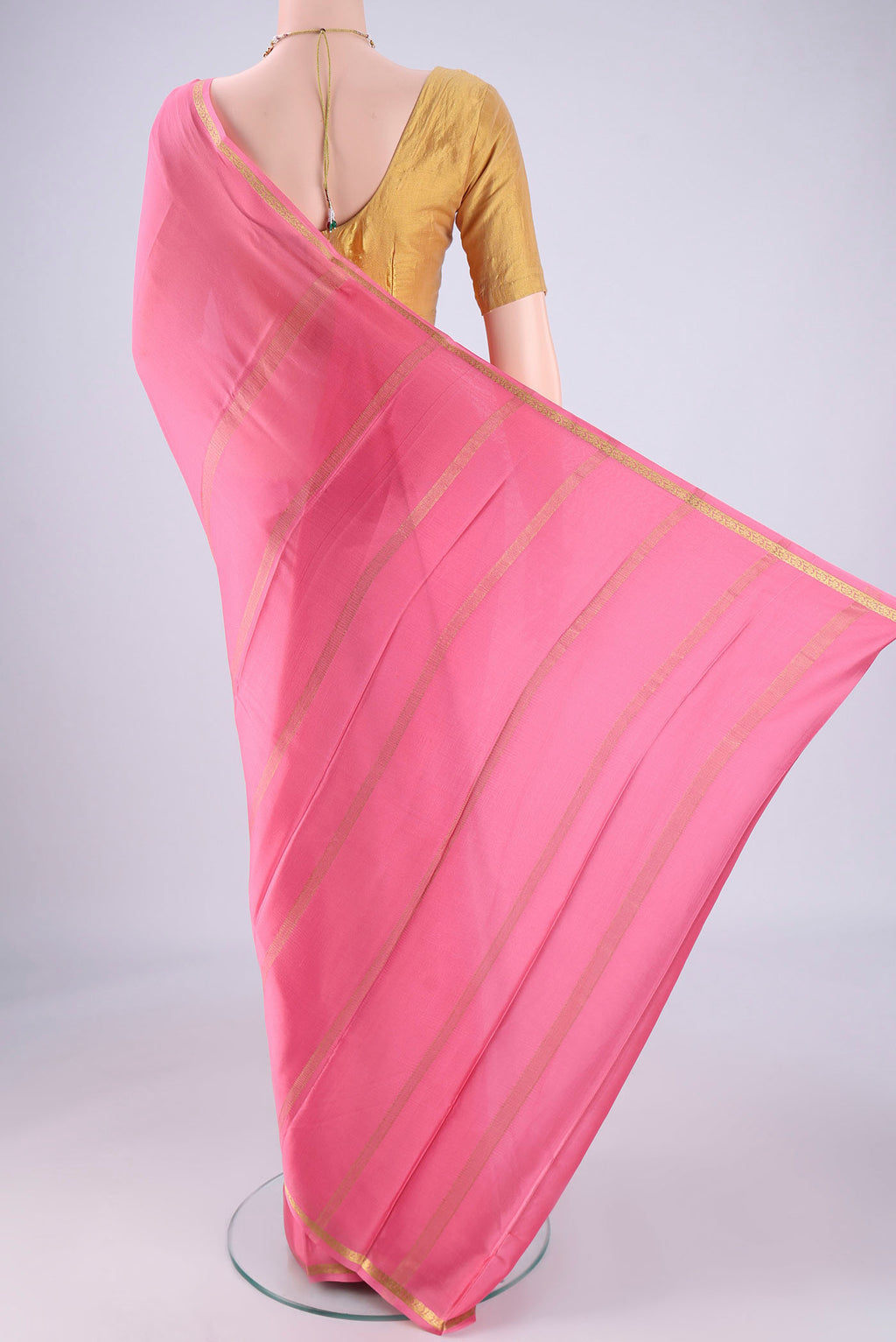 Flat view of Rose pink Mysore Crepe Saree with Plain Body and Zari Border. 