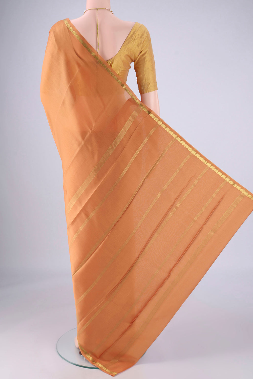 Flat view of Salmon Mysore Crepe Saree with Plain Body and Zari Border. 