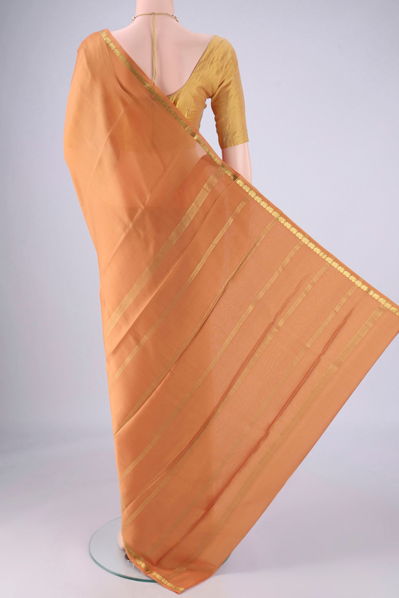 Flat view of Salmon Mysore Crepe Saree with Plain Body and Zari Border. 