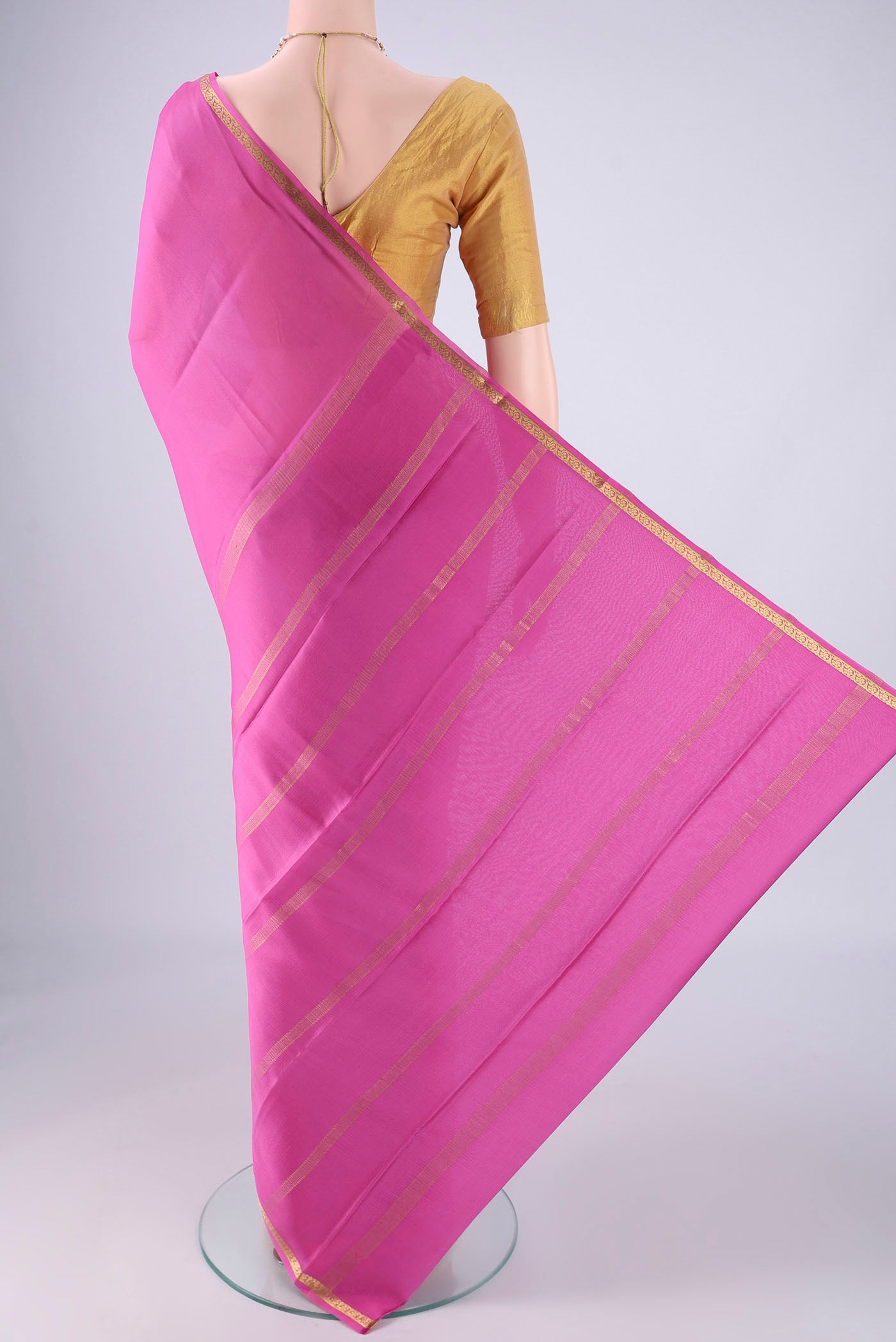 Flat view of Pink Mysore Crepe Saree with Plain Body and Zari Border. 