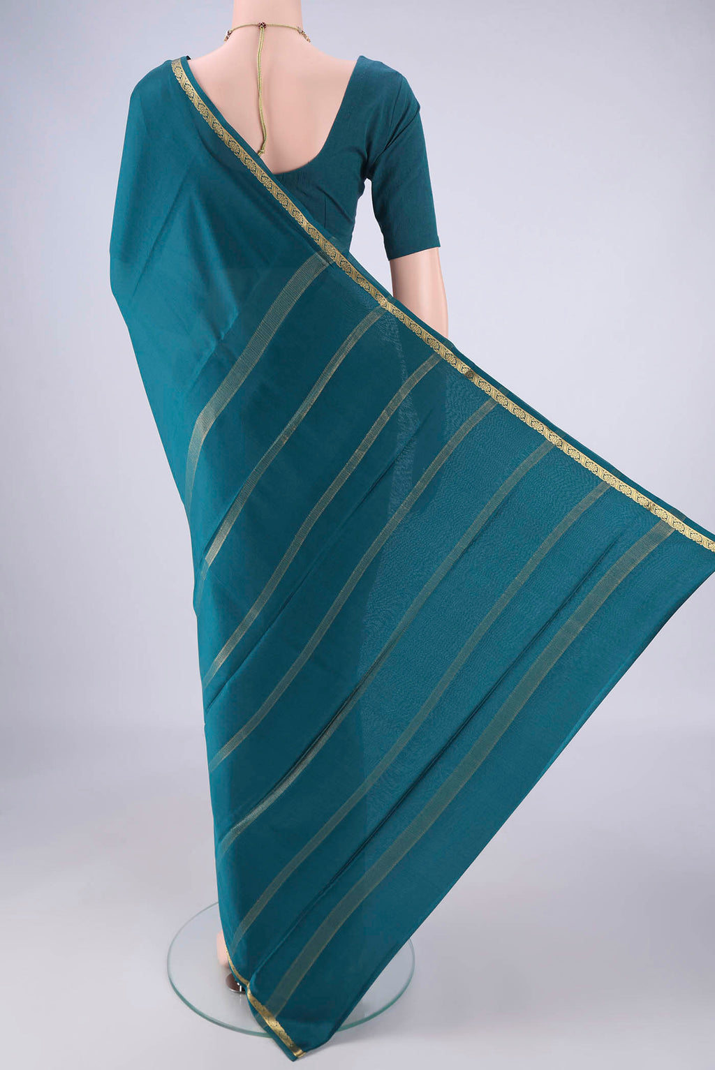 Flat view of Teal Mysore Crepe Saree with Plain Body and Zari Border. 