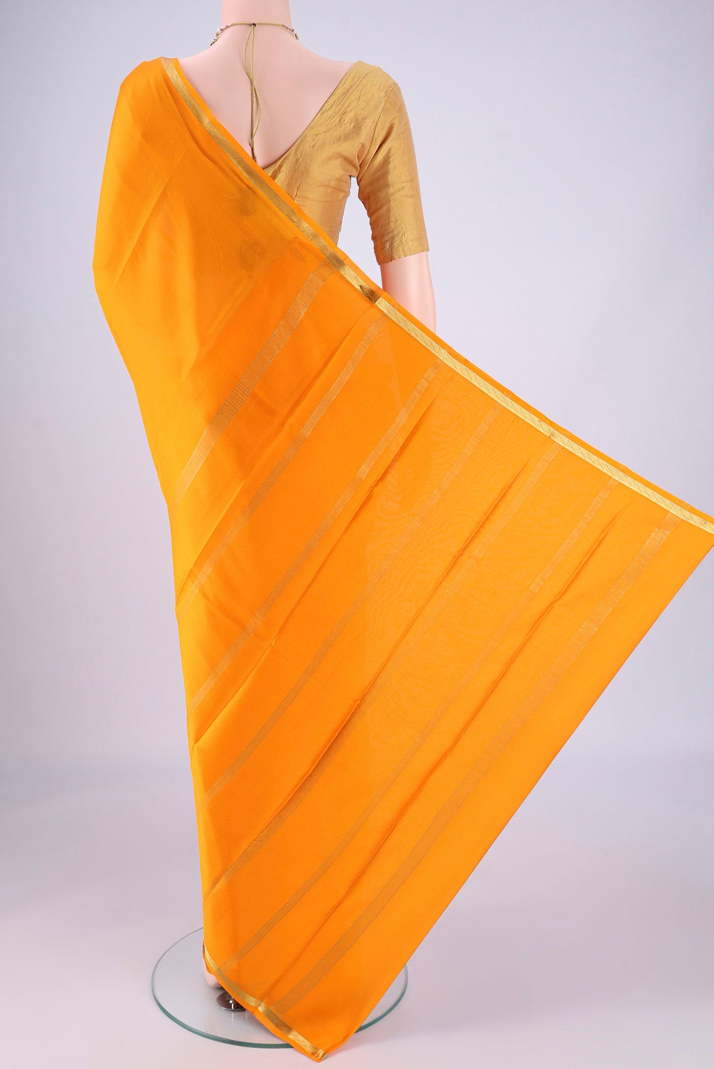 Flat view of Yellow Mysore Crepe Saree with Plain Body and Zari Border. 