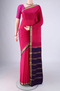 Rani Pink Mysore Crepe Saree with Plain Body and Zari Border.  displayed on a mannequin