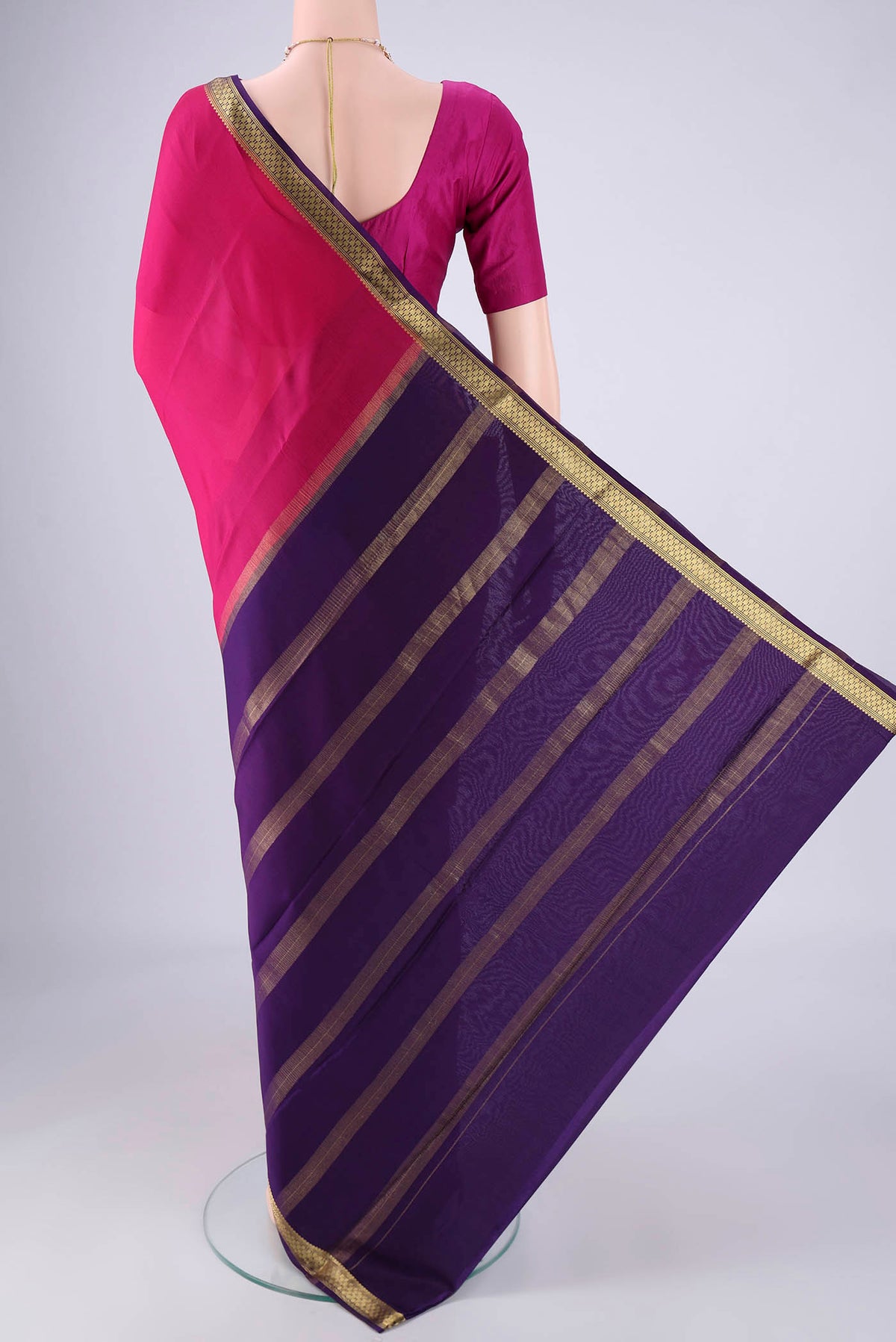 Flat view of Rani Pink Mysore Crepe Saree with Plain Body and Zari Border. 