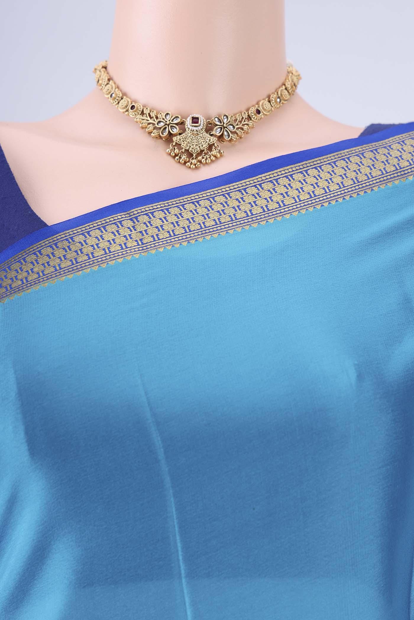 Border image of Blue Mysore Crepe Saree with Plain Body and Zari Border. 