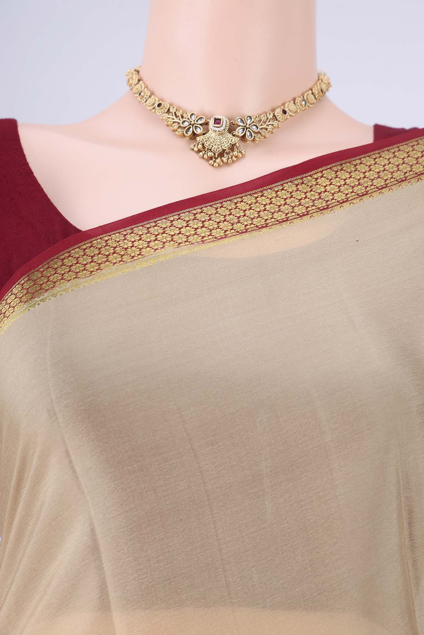 Border image of Beige Mysore Crepe Saree with Plain Body and Zari Border. 