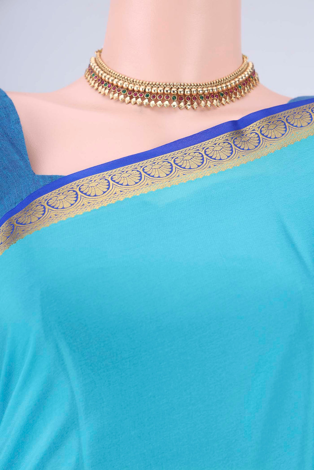 Border image of Sky Blue Mysore Crepe Saree with Plain Body and Zari Border. 