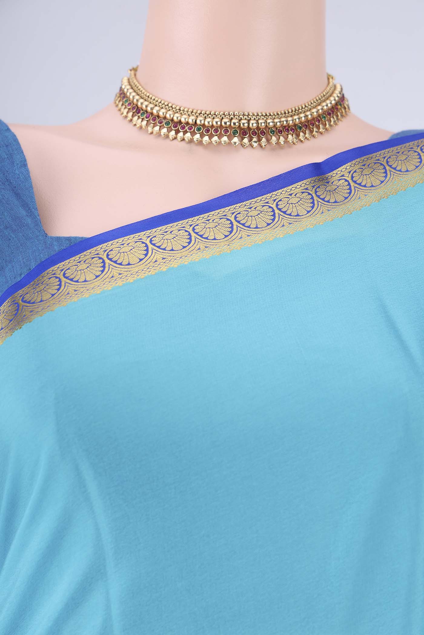 Border image of Sky Blue Mysore Crepe Saree with Plain Body and Zari Border. 
