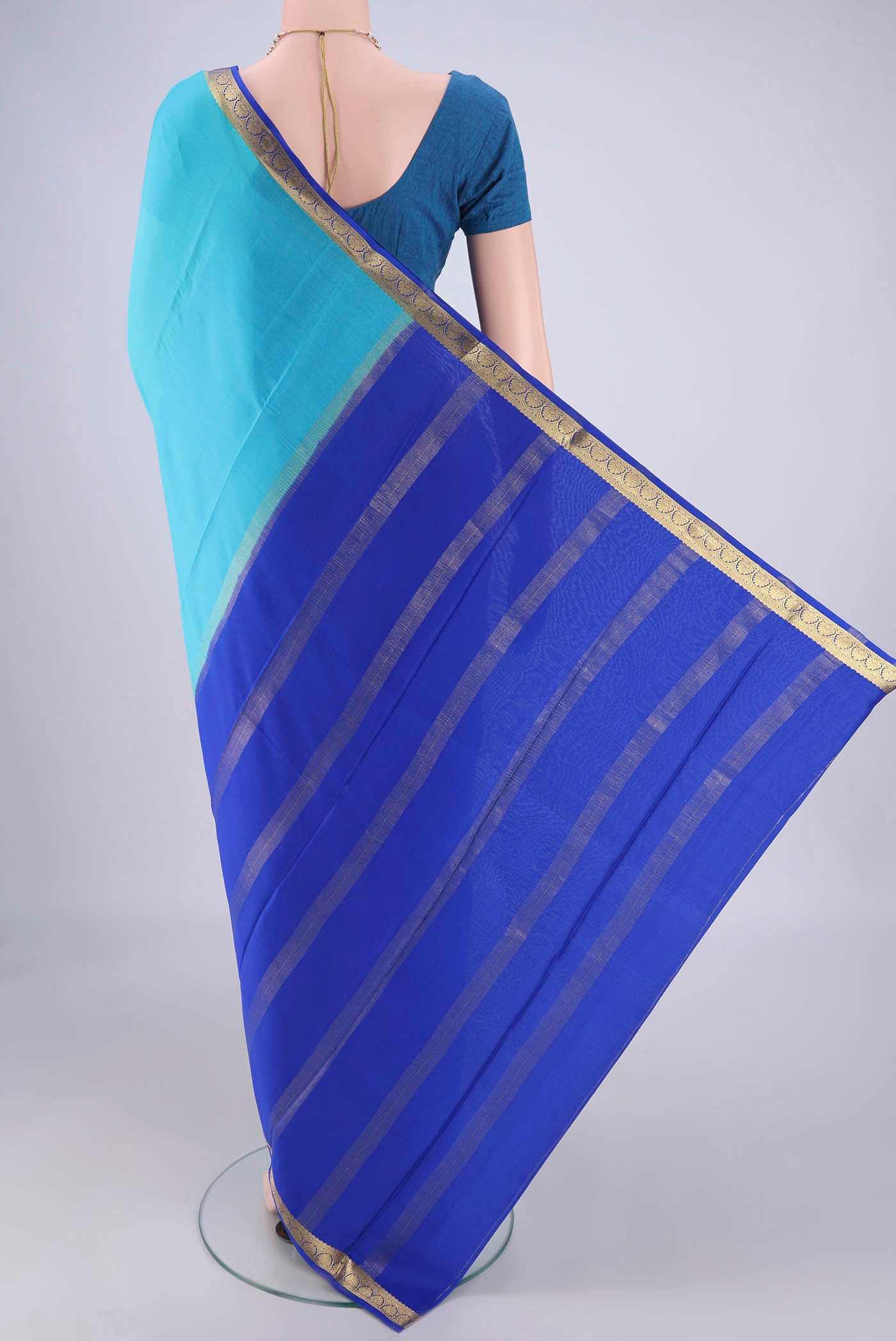 Flat view of Sky Blue Mysore Crepe Saree with Plain Body and Zari Border. 