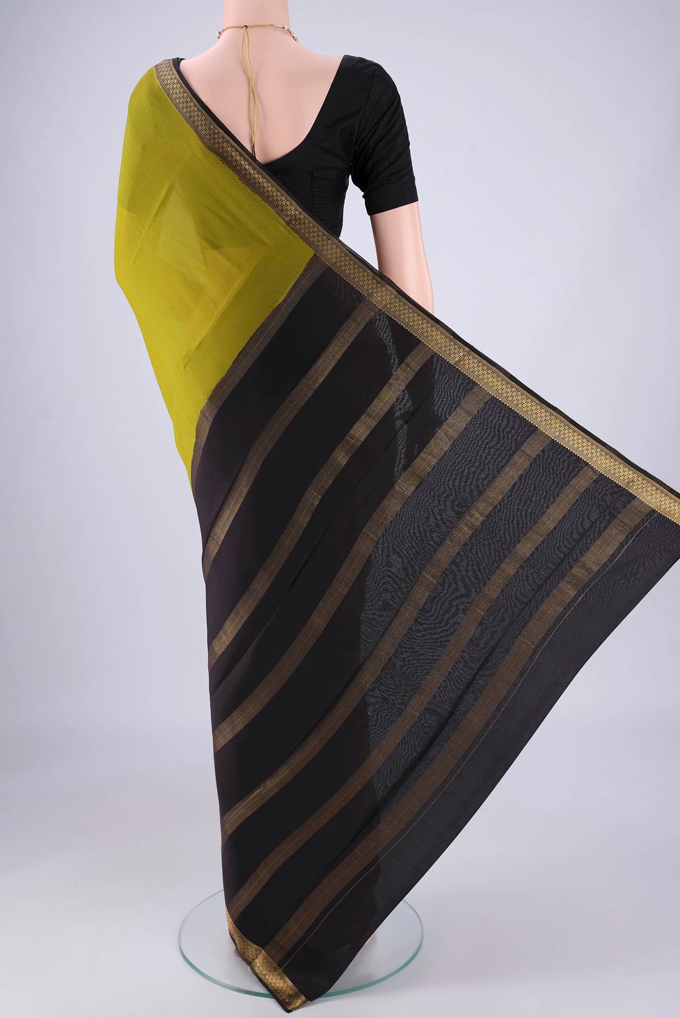 Flat view of Mehandi Green Mysore Crepe Saree with Plain Body and Zari Border. 