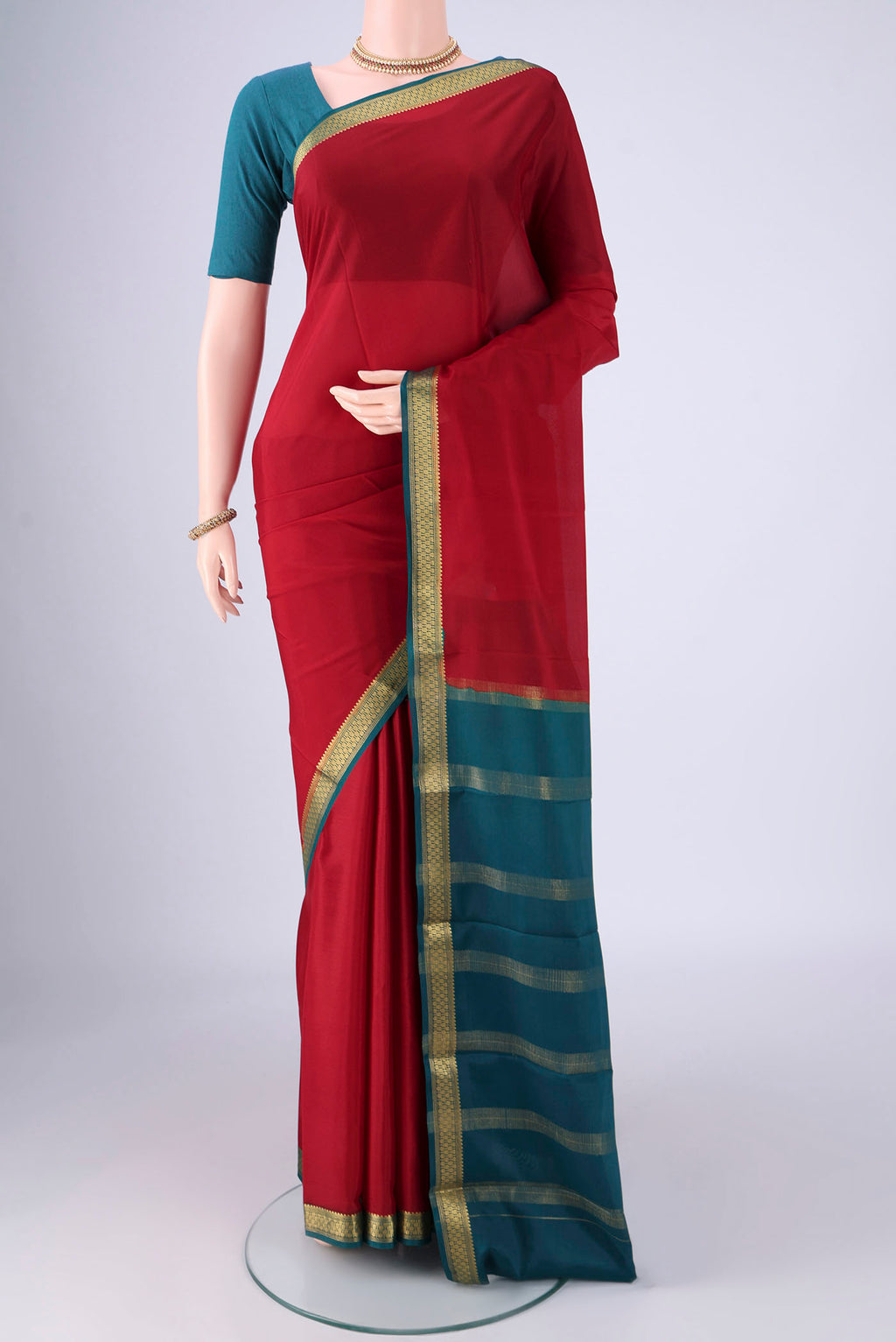Maroon Mysore Crepe Saree with Plain Body and Zari Border.  displayed on a mannequin