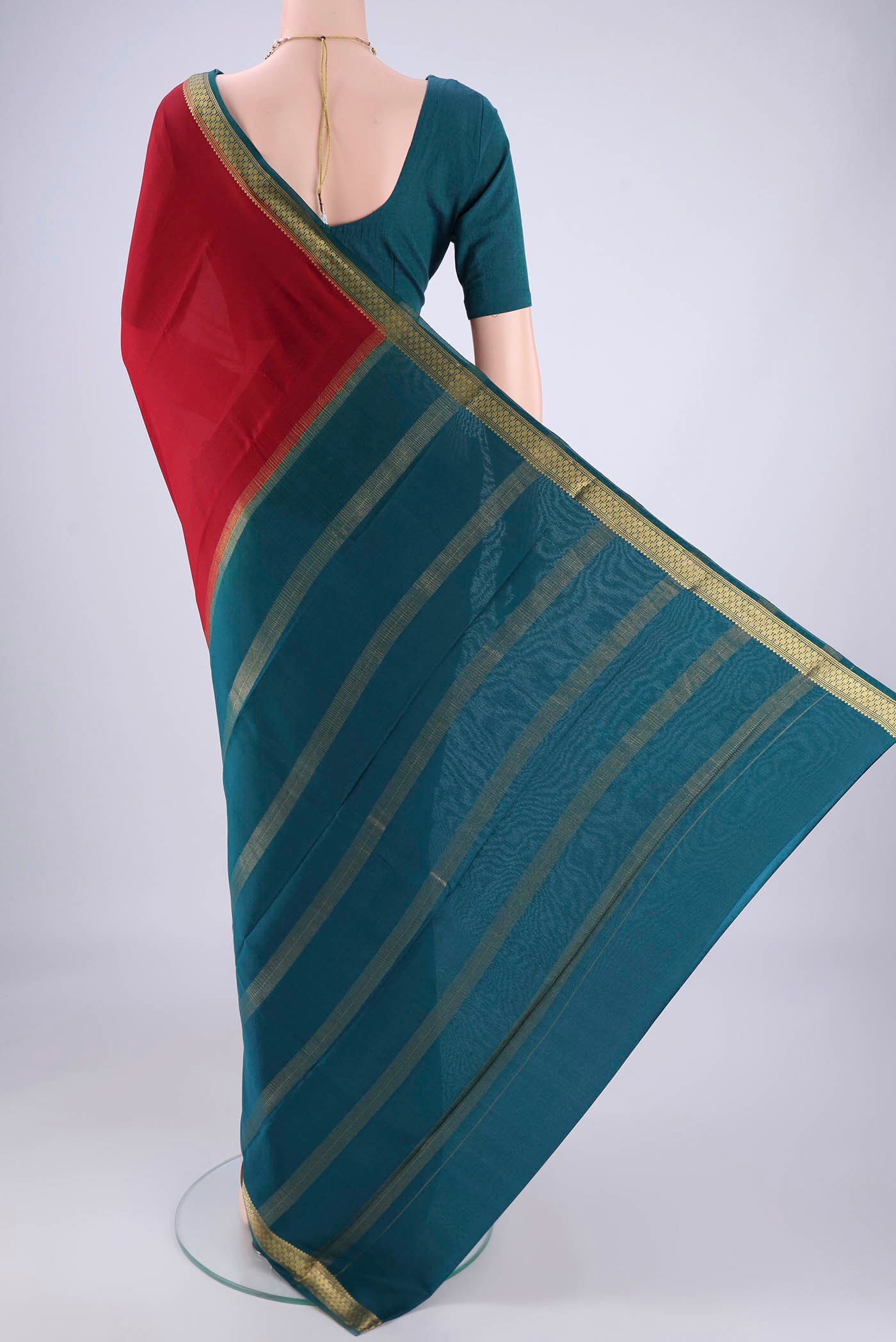 Flat view of Maroon Mysore Crepe Saree with Plain Body and Zari Border. 