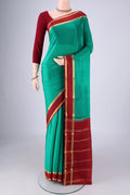 Sea Green Mysore Crepe Saree with Plain Body and Zari Border.  displayed on a mannequin