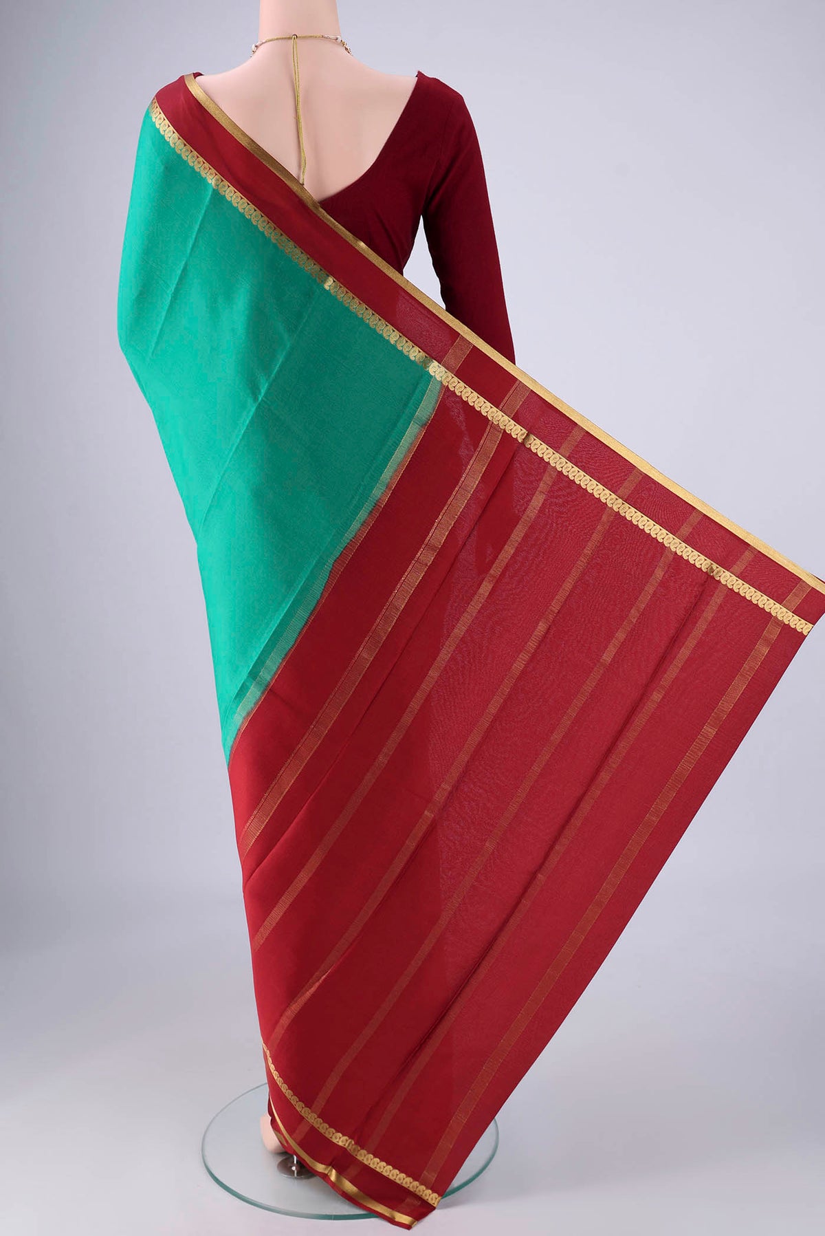 Flat view of Sea Green Mysore Crepe Saree with Plain Body and Zari Border. 