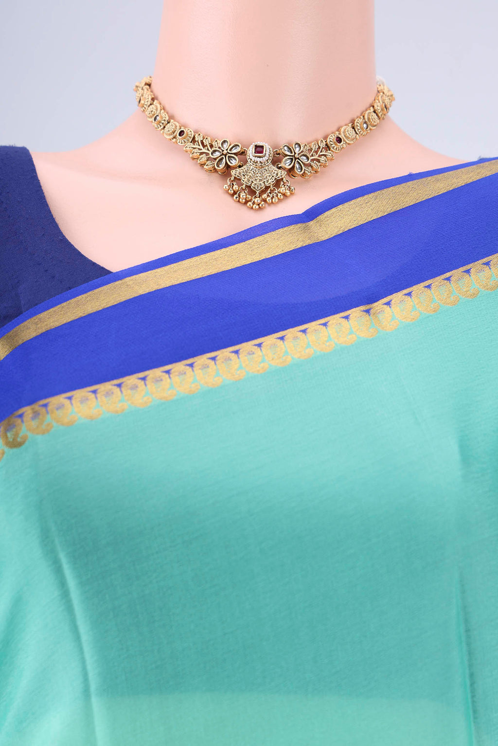 Border image of Mint Green Mysore Crepe Saree with Plain Body and Zari Border. 