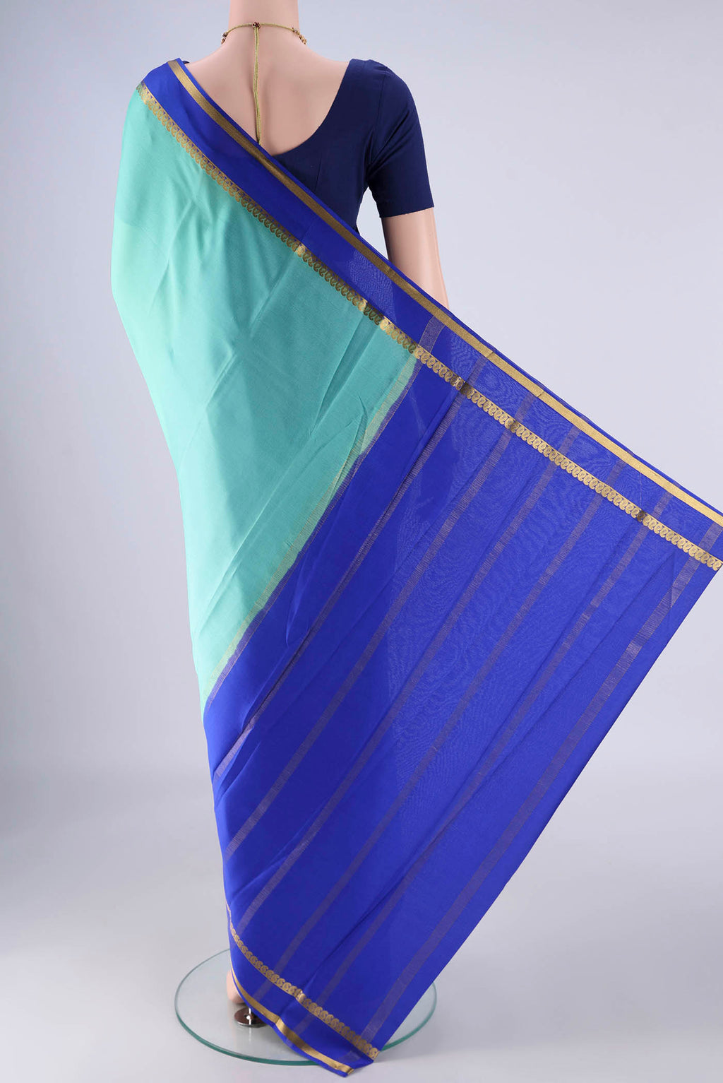 Flat view of Mint Green Mysore Crepe Saree with Plain Body and Zari Border. 
