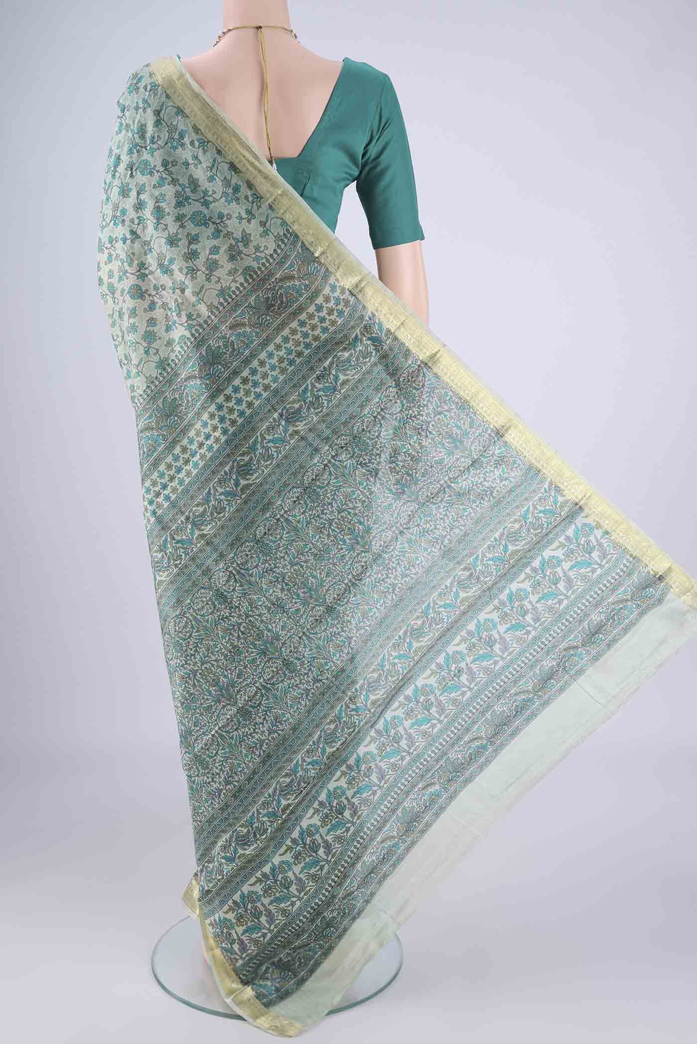 Flat view of Sage Green Printed Silk Saree with Printed design on the body and Zari Border. 