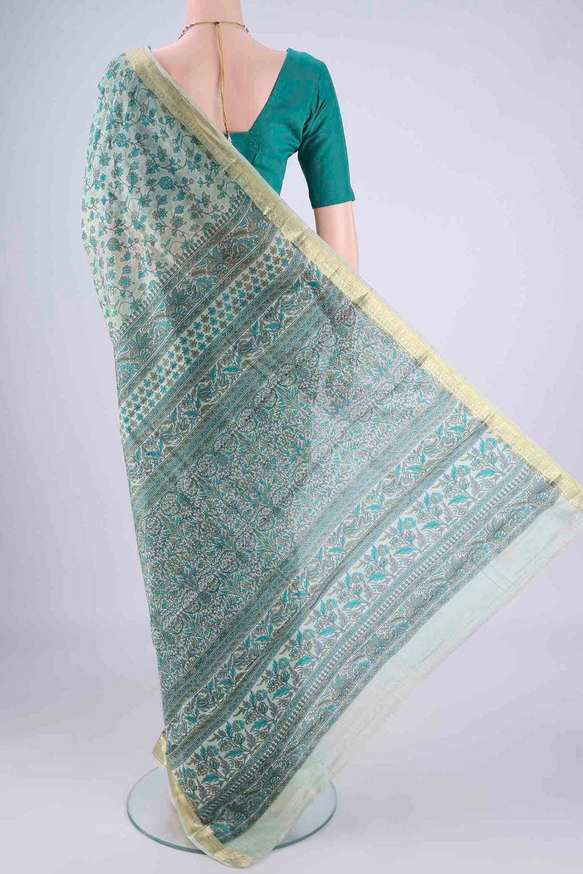 Flat view of Sage Green Printed Silk Saree with Printed design on the body and Zari Border. 