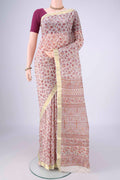 Off White Printed Silk Saree with Printed design on the body and Zari Border.  displayed on a mannequin