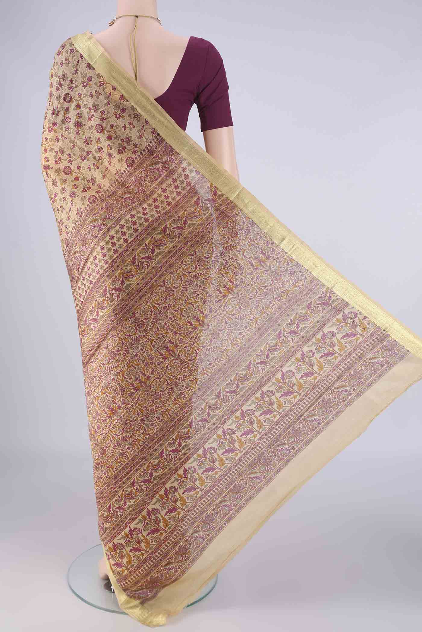 Flat view of Beige Printed Silk Saree with Printed design on the body and Zari Border. 