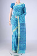Blue Printed Silk Saree with Printed design on the body and Zari Border.  displayed on a mannequin