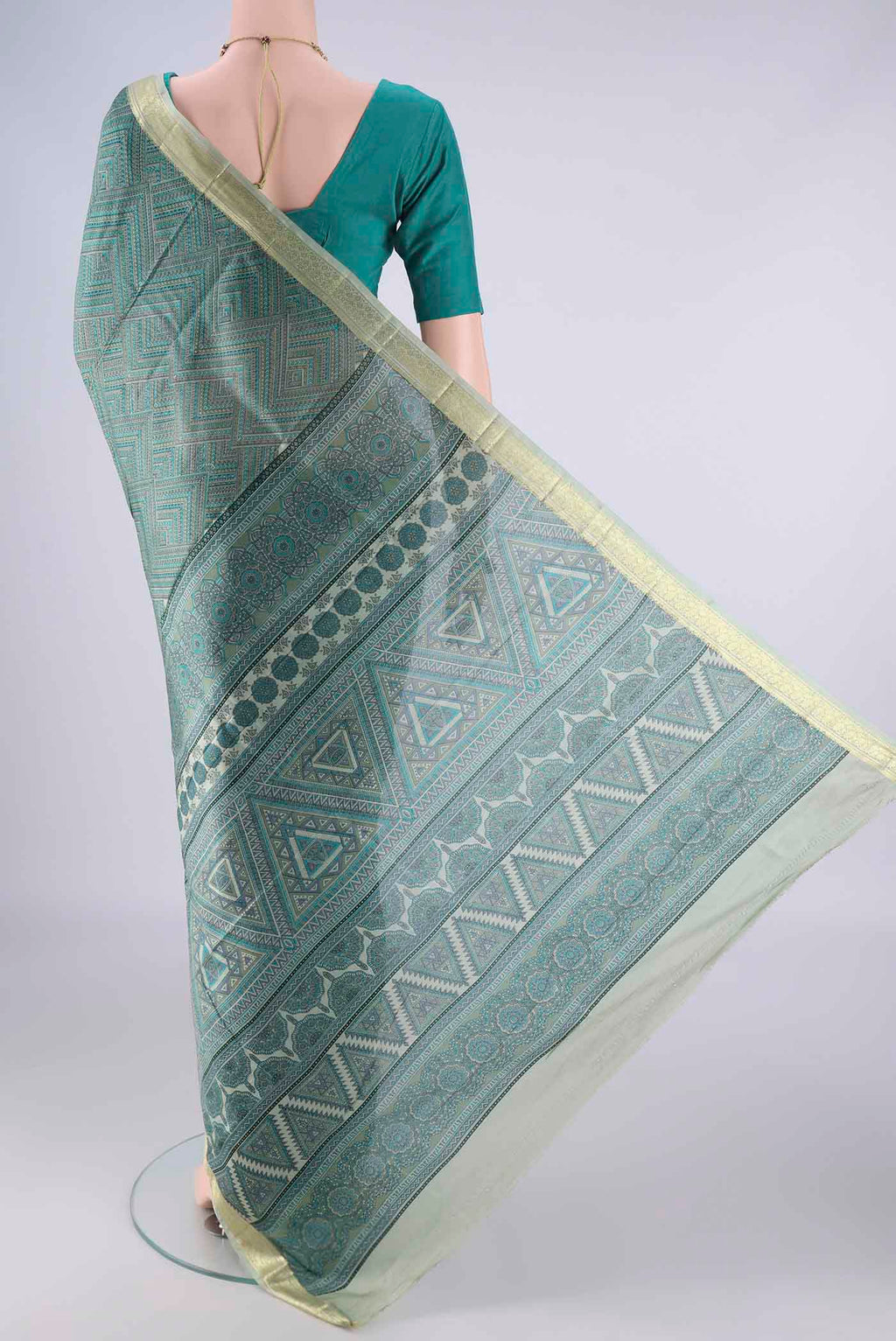 Flat view of Sea Green Printed Silk Saree with Printed design on the body and Printed Border. 