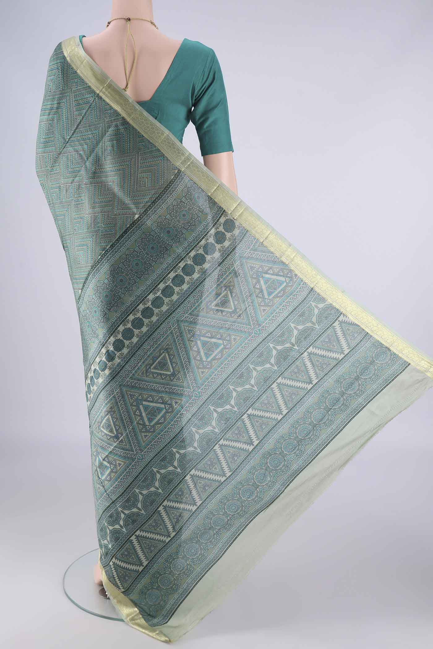 Flat view of Sea Green Printed Silk Saree with Printed design on the body and Printed Border. 