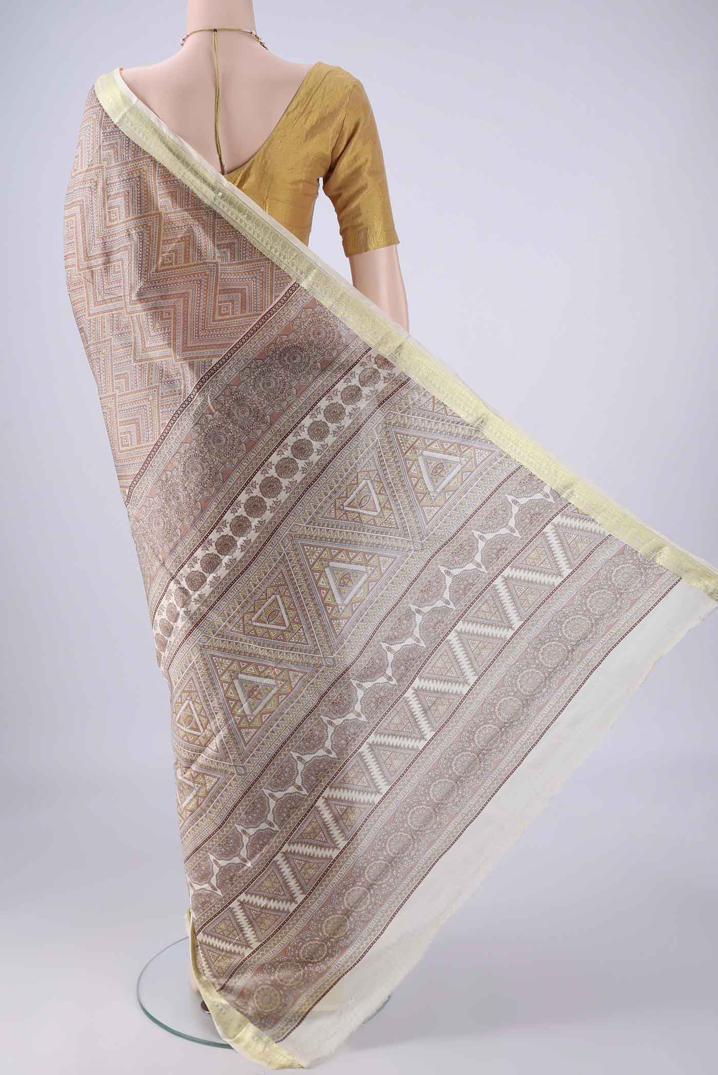 Flat view of Brown Printed Silk Saree with Printed design on the body and Zari Border. 
