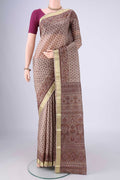 Dark Beige Printed Silk Saree with Printed design on the body and Zari Border.  displayed on a mannequin