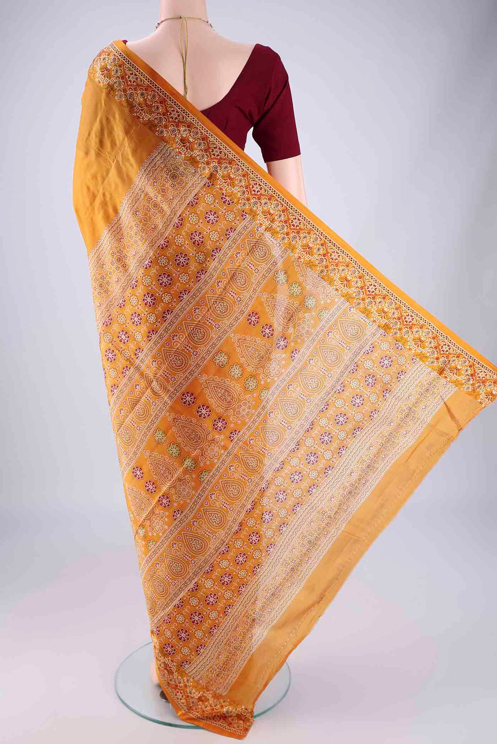 Flat view of Mustard Printed Silk Saree with Plain Body and Printed Border. 