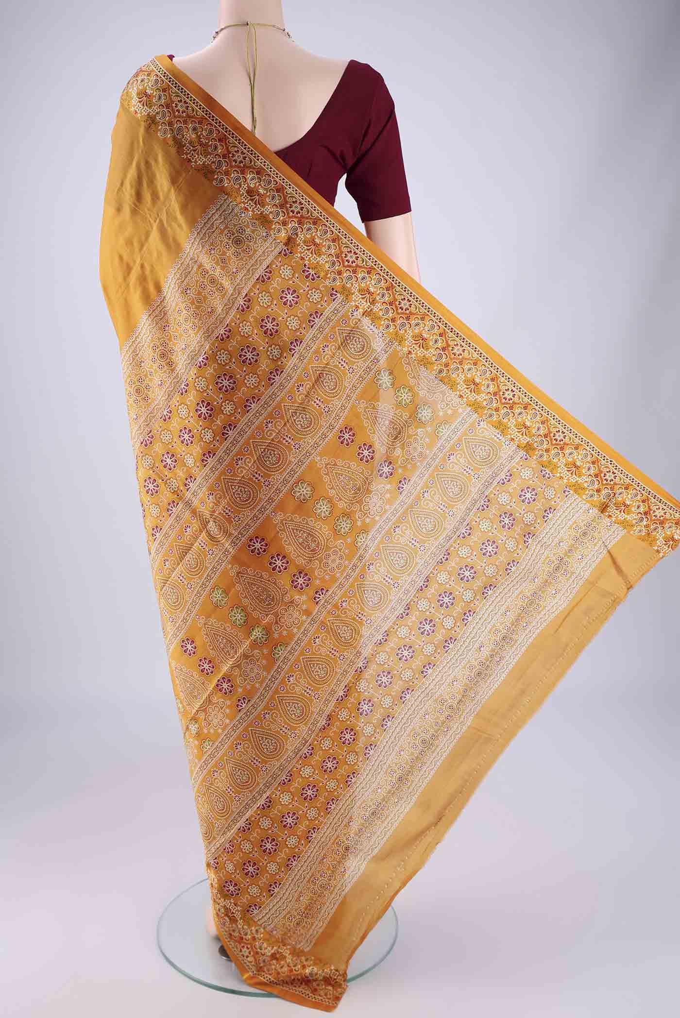 Flat view of Mustard Printed Silk Saree with Plain Body and Printed Border. 