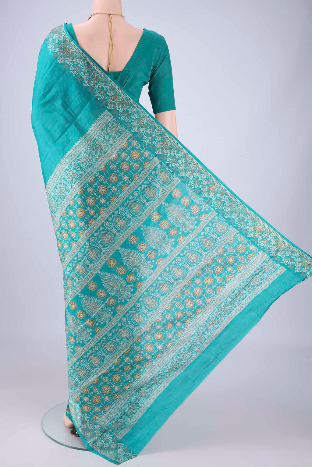 Flat view of Turquoise Printed Silk Saree with Plain Body and Printed Border. 