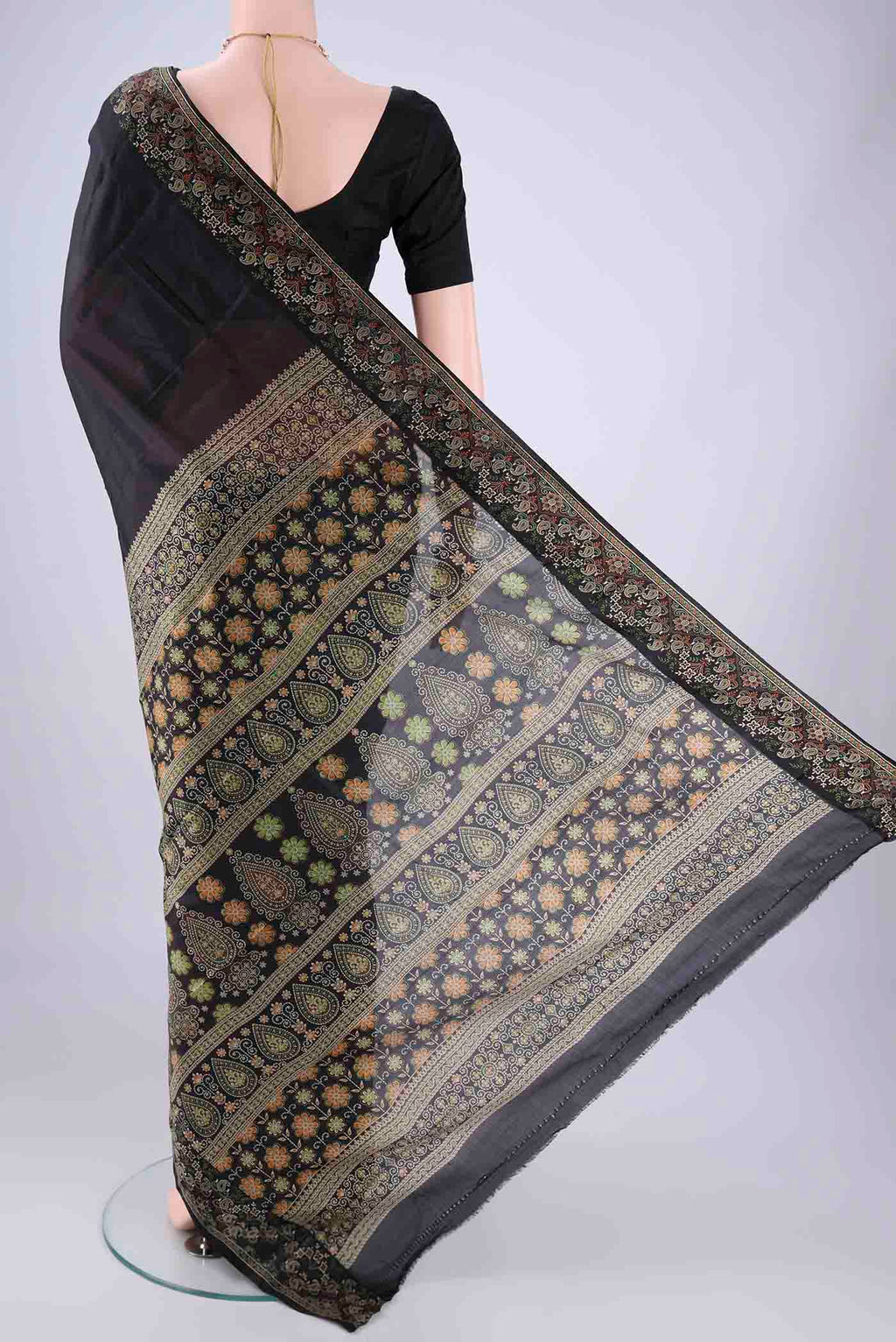 Flat view of Black Printed Silk Saree with Plain Body and Printed Border. 