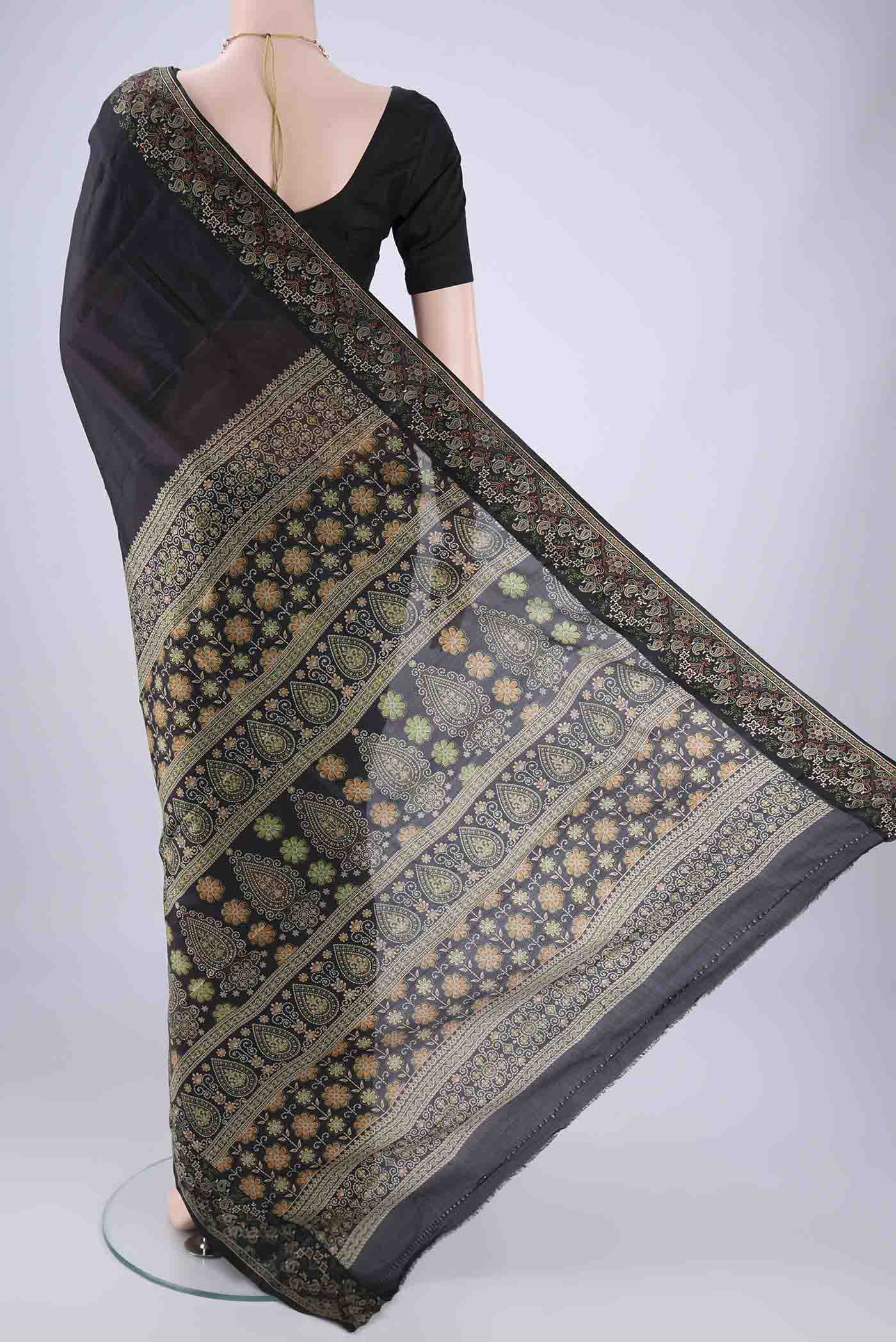 Flat view of Black Printed Silk Saree with Plain Body and Printed Border. 