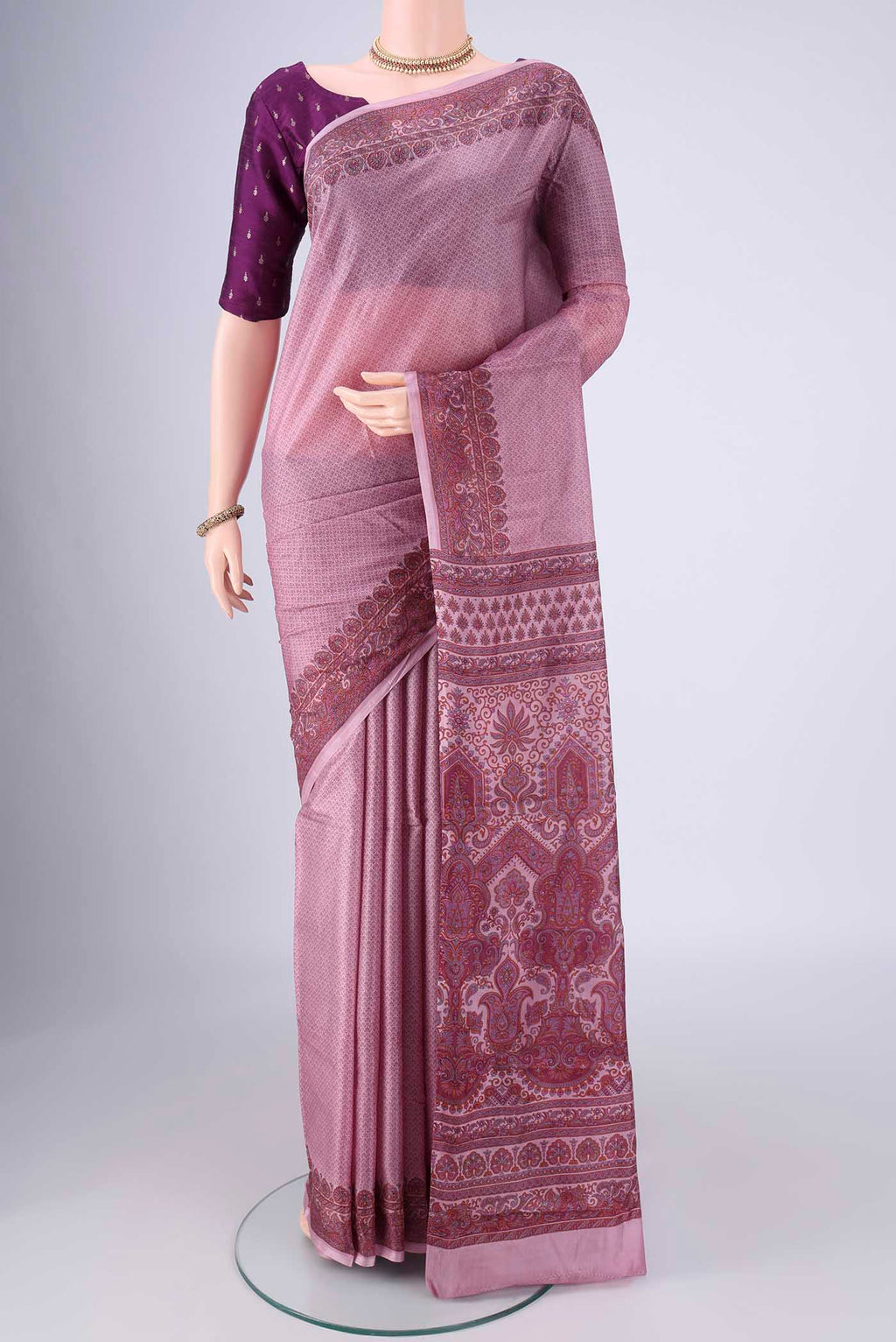 Lavender Printed Silk Saree with Printed design on the body and Printed Border.  displayed on a mannequin