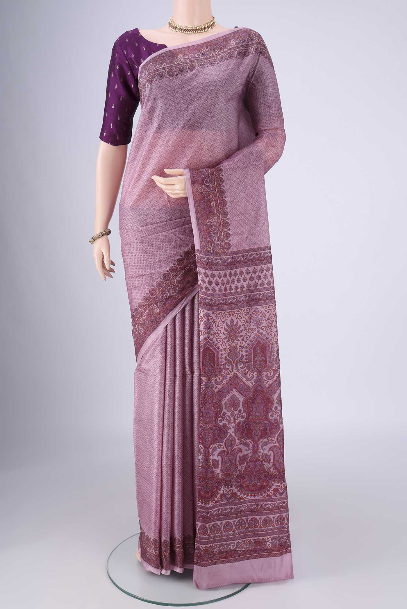 Lavender Printed Silk Saree with Printed design on the body and Printed Border.  displayed on a mannequin