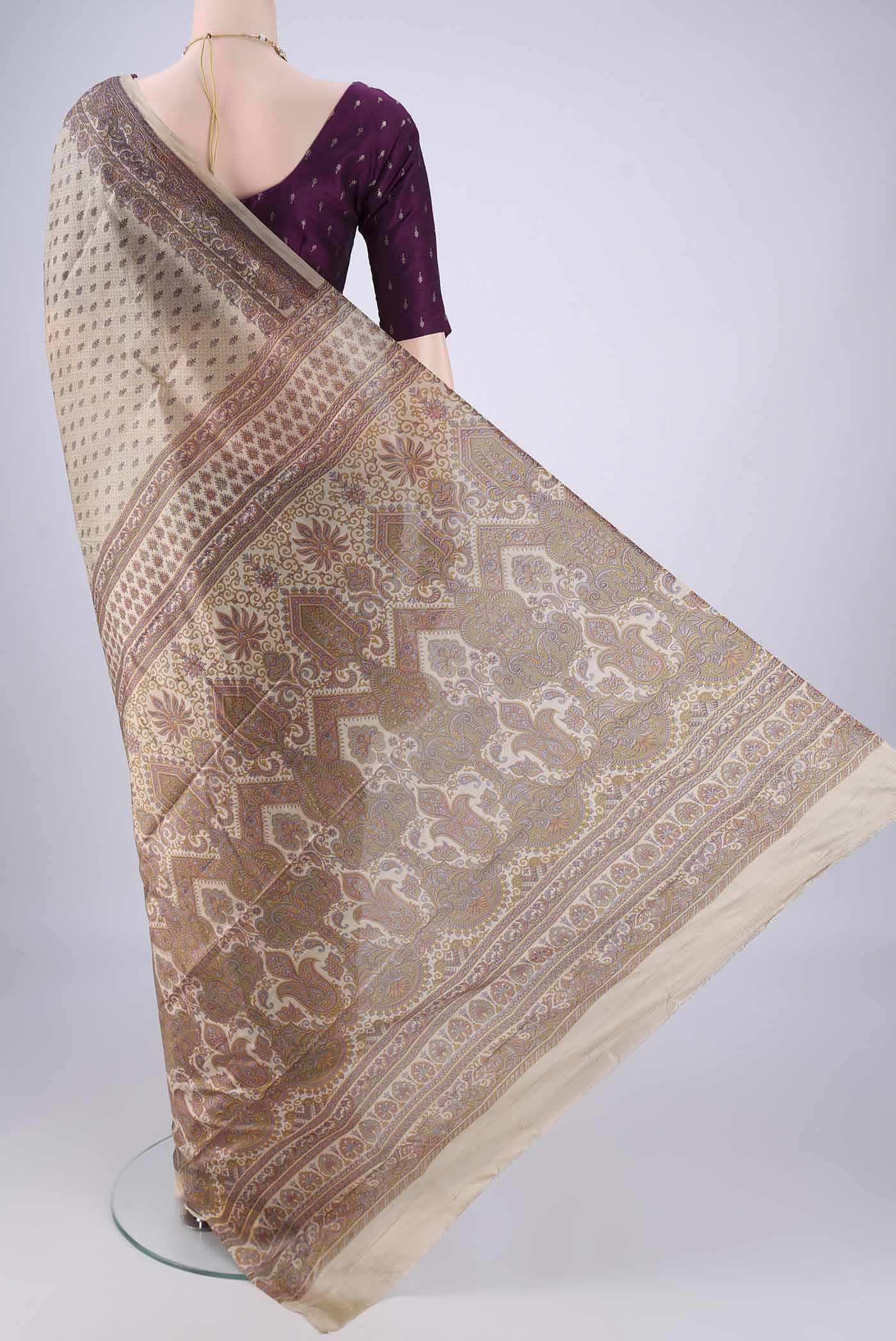 Flat view of Beige Printed Silk Saree with Printed design on the body and Printed Border. 
