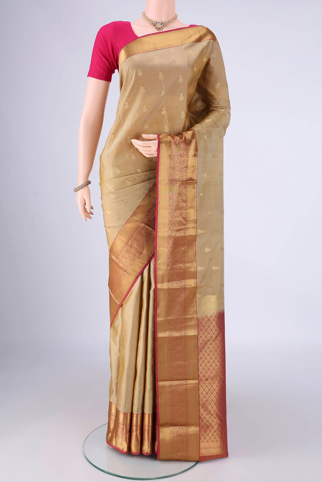 Dark Beige Nangavalli Silk [ Salem ] Saree with Zari Butta on the body and Zari Border.  displayed on a mannequin