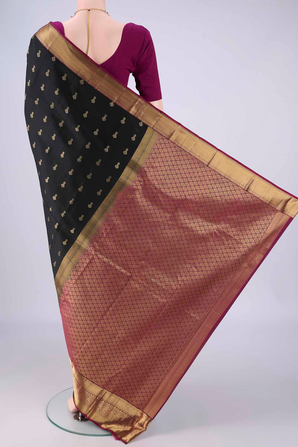 Flat view of Black Kanjivaram Silk Saree with Zari Butta on the body and Zari Border. 