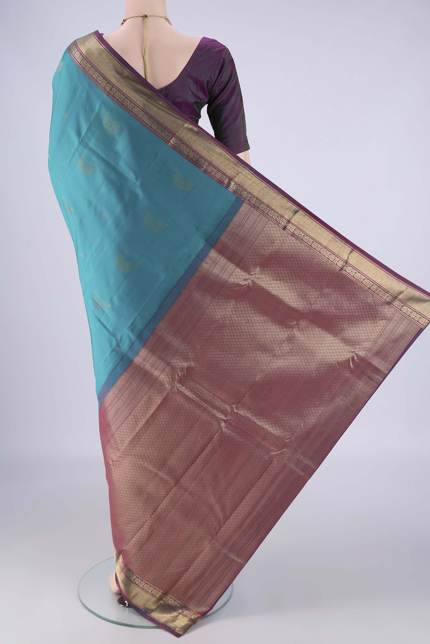 Flat view of Sea Green Nangavalli Silk [ Salem ] Saree with Zari Butta on the body and Zari Border. 