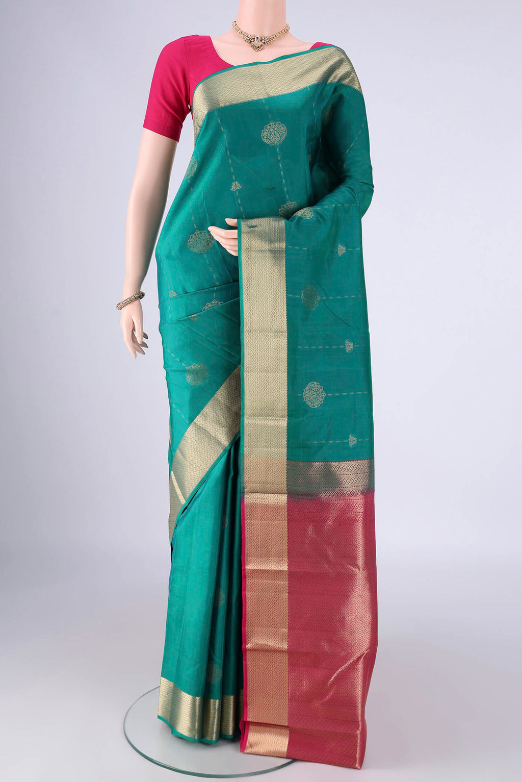 Sea Green Nangavalli Silk [ Salem ] Saree with Zari Butta on the body and Zari Border.  displayed on a mannequin