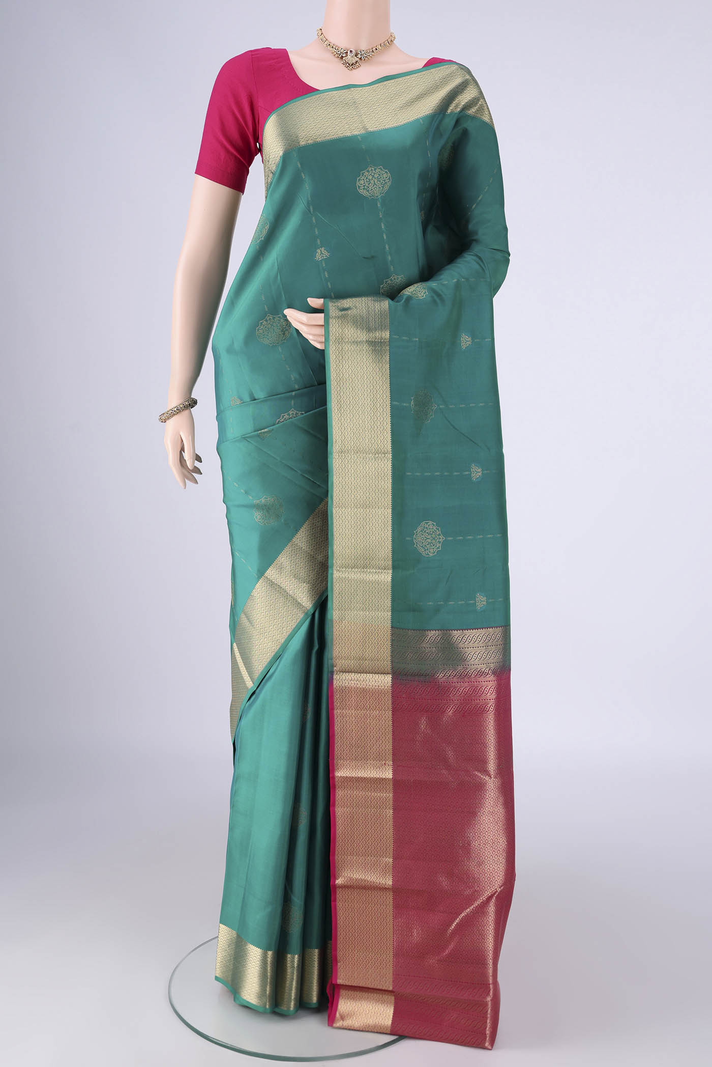 Sea Green Nangavalli Silk [ Salem ] Saree with Zari Butta on the body and Zari Border.  displayed on a mannequin