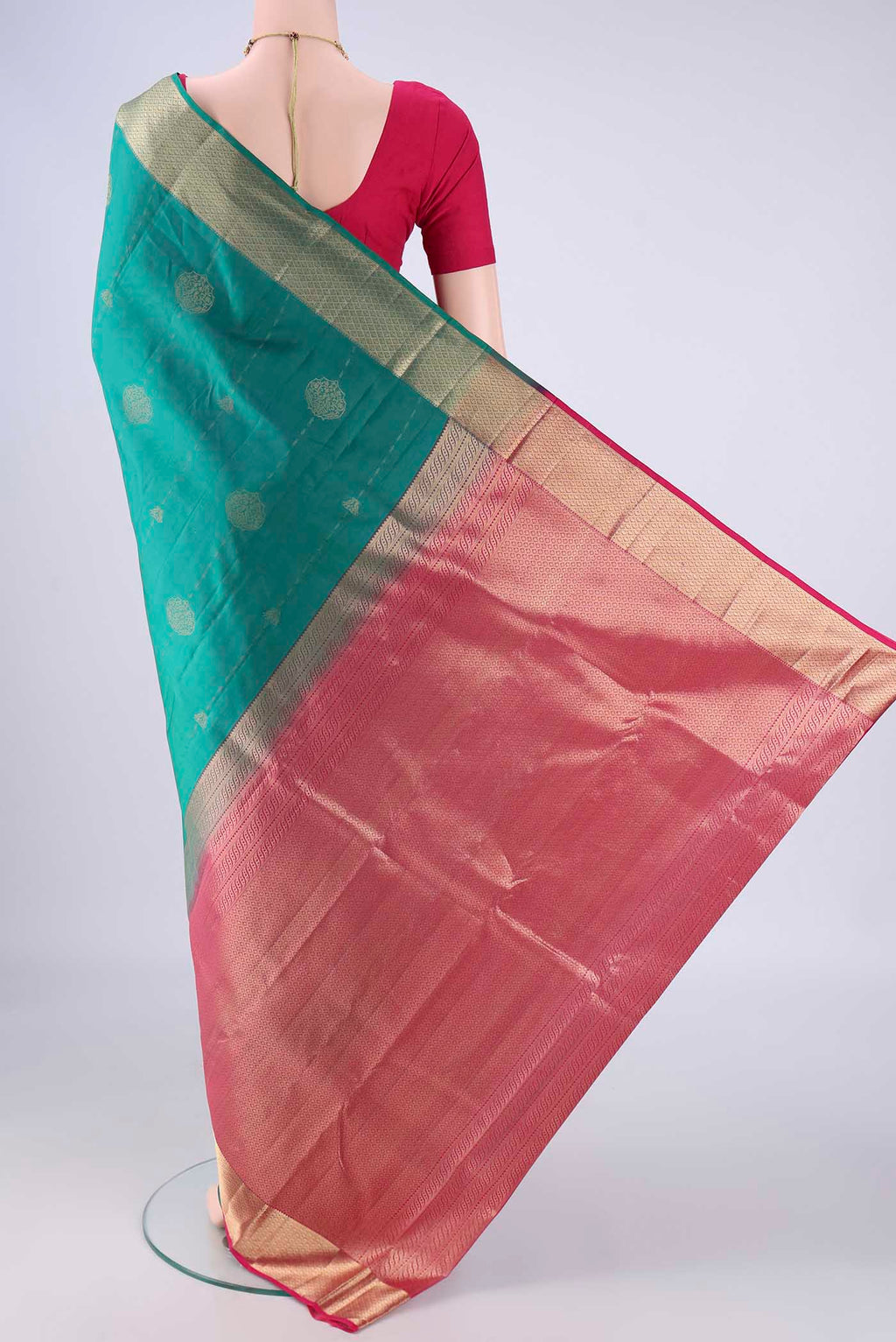 Flat view of Sea Green Nangavalli Silk [ Salem ] Saree with Zari Butta on the body and Zari Border. 