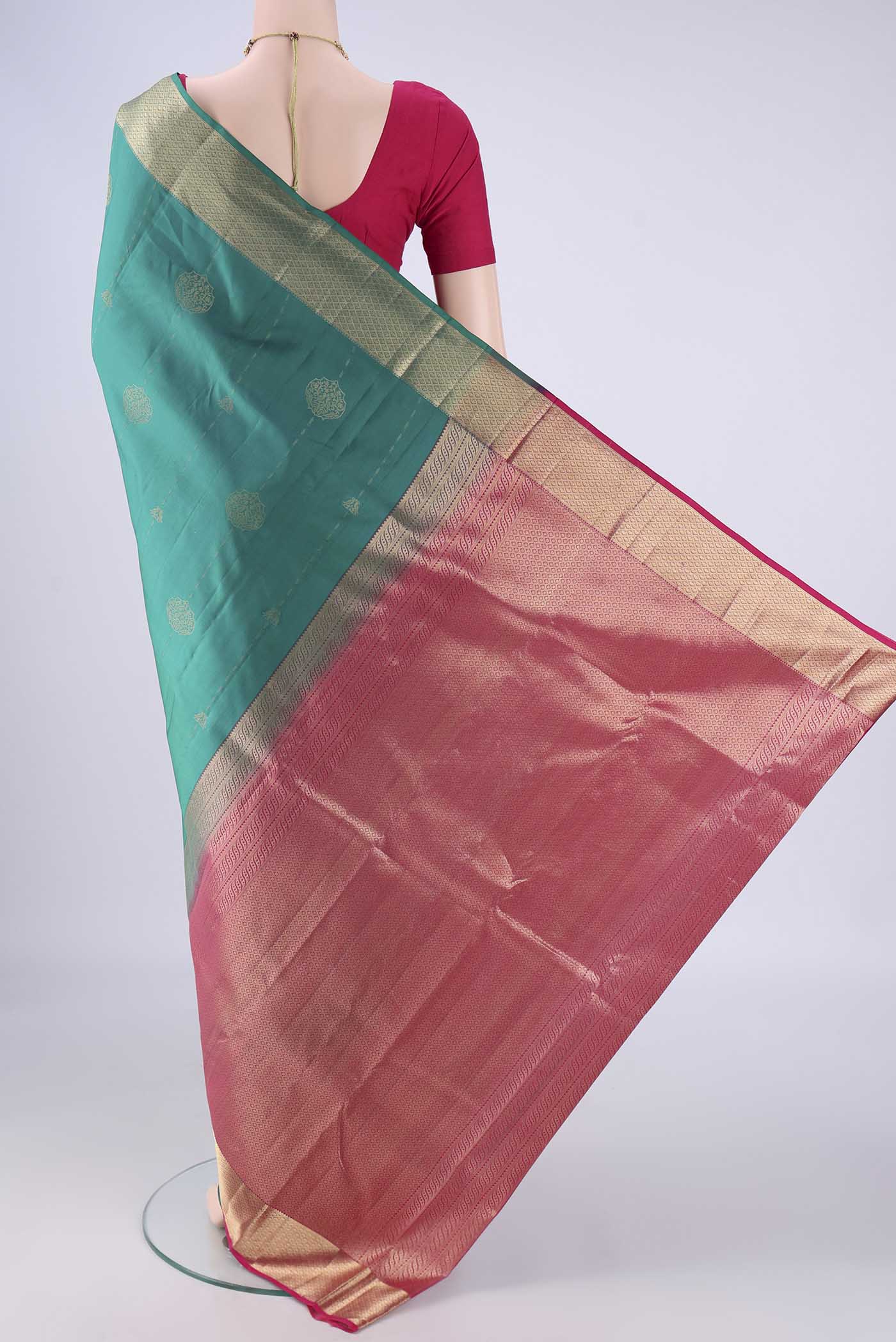 Flat view of Sea Green Nangavalli Silk [ Salem ] Saree with Zari Butta on the body and Zari Border. 