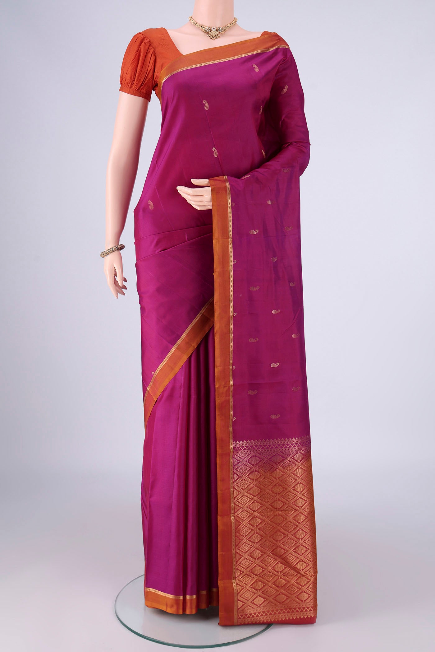 Magenta Nangavalli Silk [ Salem ] Saree with Zari Butta on the body and Zari Border.  displayed on a mannequin