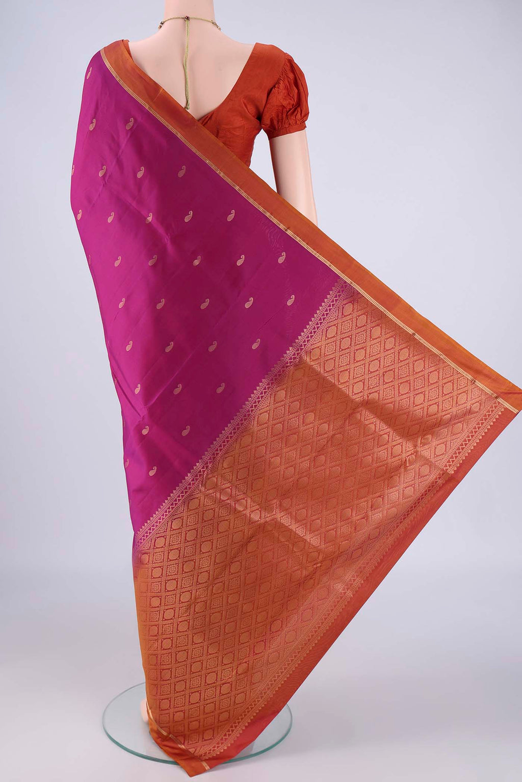 Flat view of Magenta Nangavalli Silk [ Salem ] Saree with Zari Butta on the body and Zari Border. 