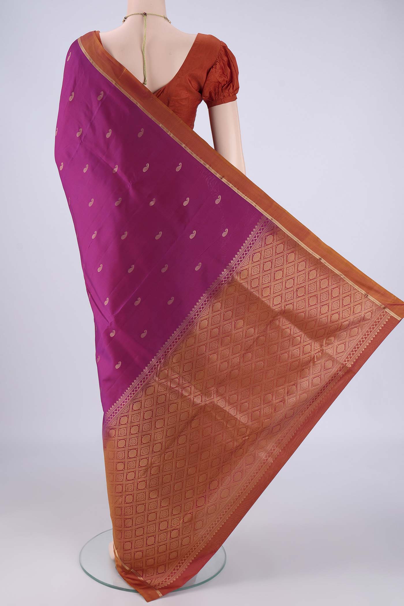 Flat view of Magenta Nangavalli Silk [ Salem ] Saree with Zari Butta on the body and Zari Border. 