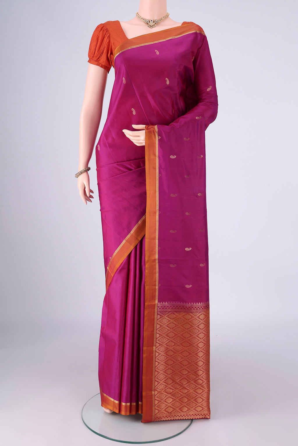 Magenta Nangavalli Silk [ Salem ] Saree with Zari Butta on the body and Zari Border.  displayed on a mannequin