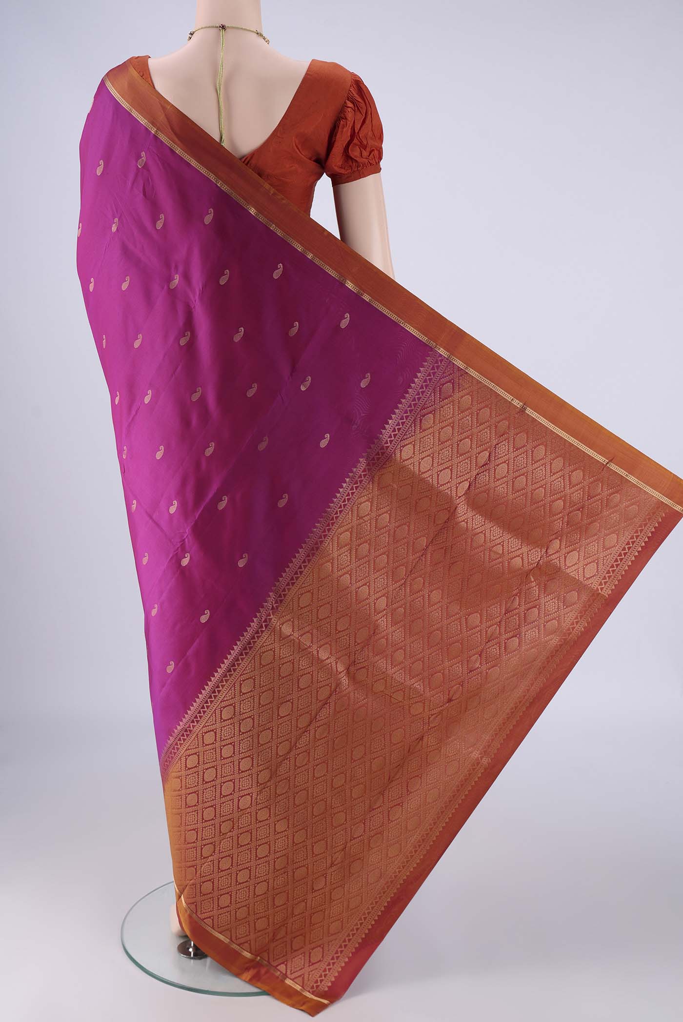 Flat view of Magenta Nangavalli Silk [ Salem ] Saree with Zari Butta on the body and Zari Border. 